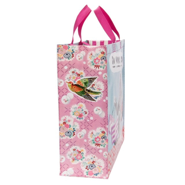 Blue Q 'so much to do' shopper with pink red and blue flowers on the side and a little green and red bird