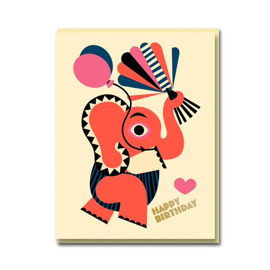 A cream coloured card with a red elephant on the front holding some balloons and colourful sticks. The text on the card reads 'Happy Birthday'