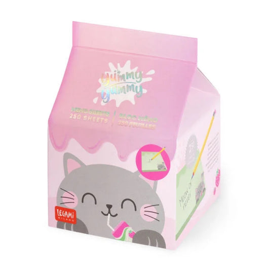 A little pink milk carton that contains 250 memo sheets. On the front there is a cat drinking some strawberry milk.