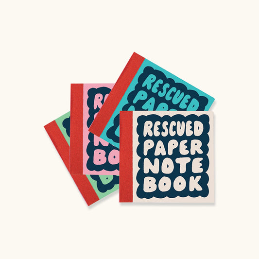 4 paper notebooks in white, blue, pink and green. On the covers of the notebooks it reads 'Rescued paper note book' 