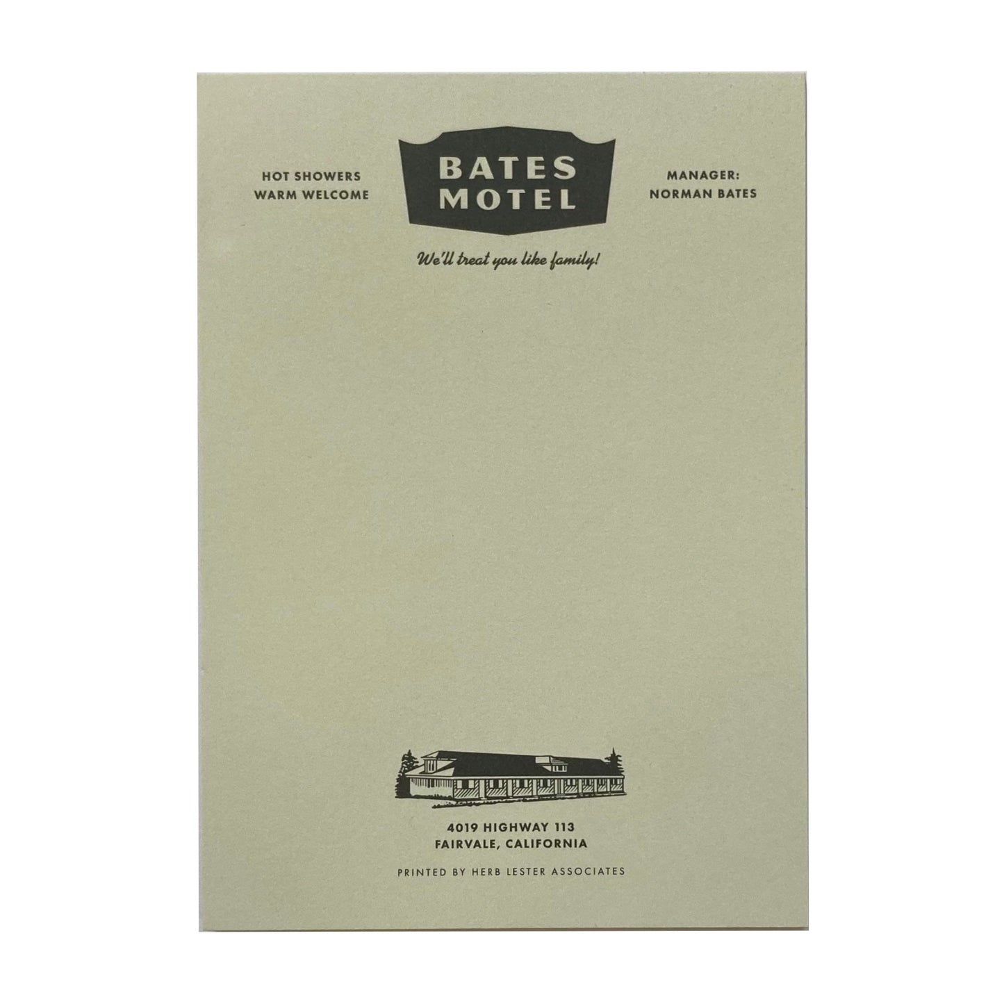 A light green notepad with 'Bates Motel' written at the top.