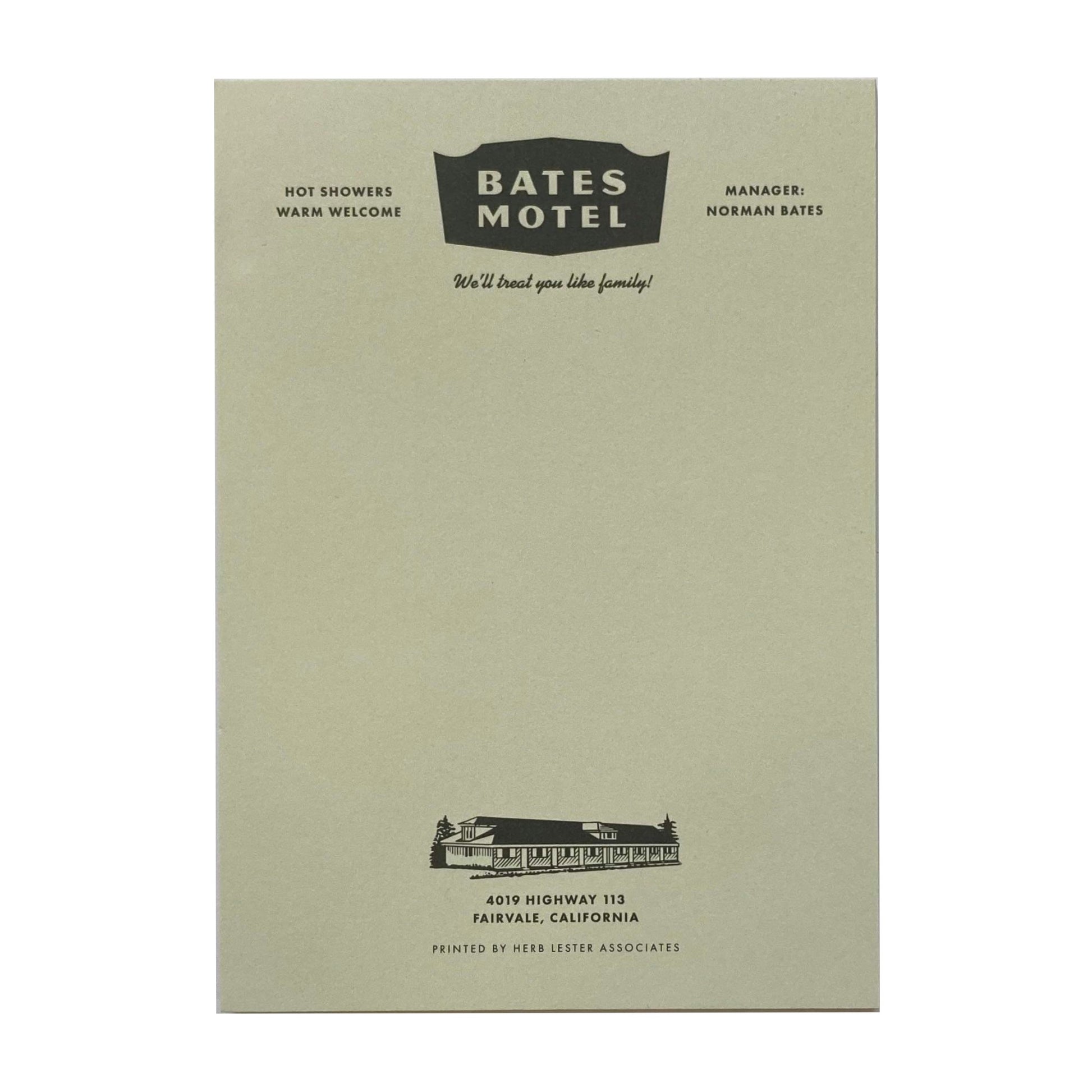 A light green notepad with 'Bates Motel' written at the top.