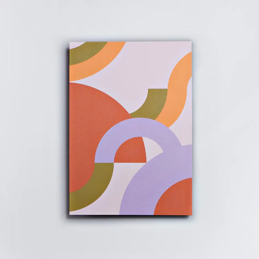 A rectangular notebook with an abstract design of curved shapes in orange, purple, and green colors.