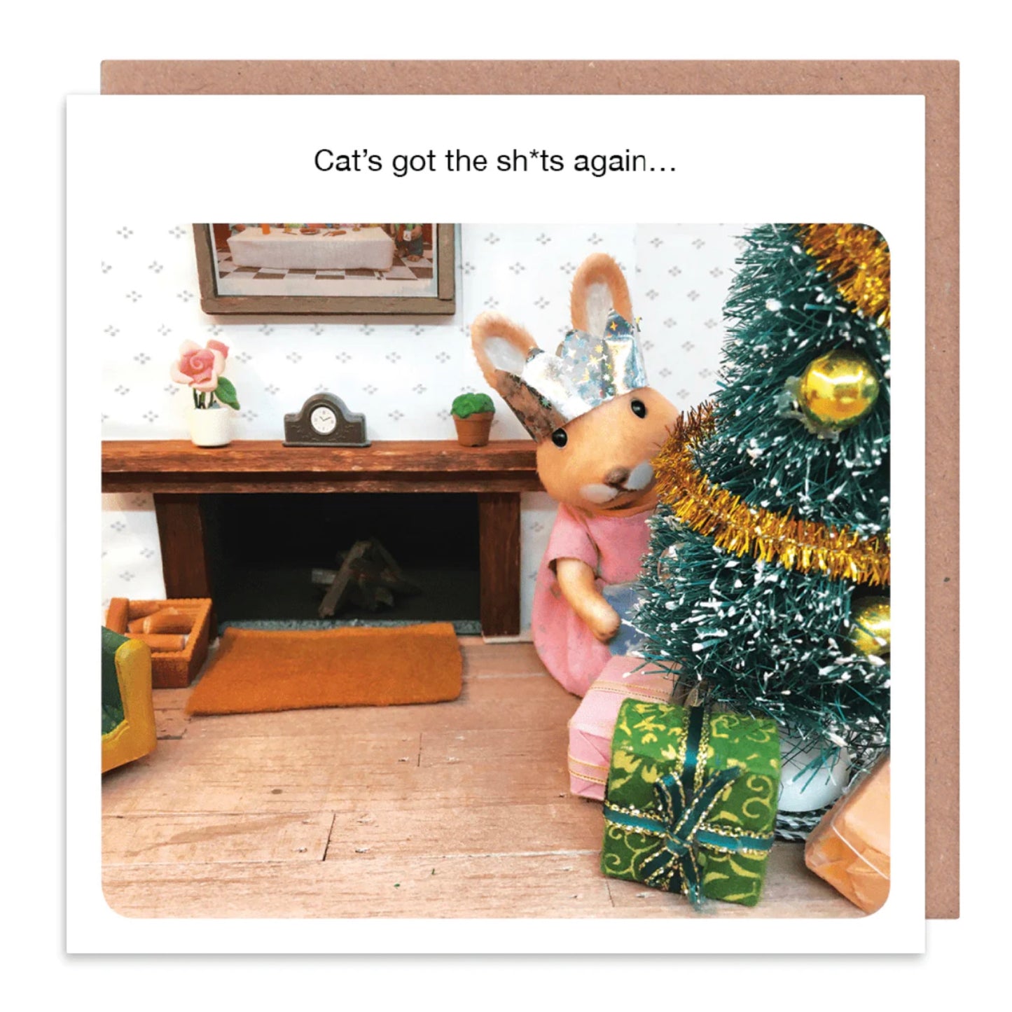 A card that reads 'Cat's got the sh*ts again..' with a rabbit and a Christmas tree on the front