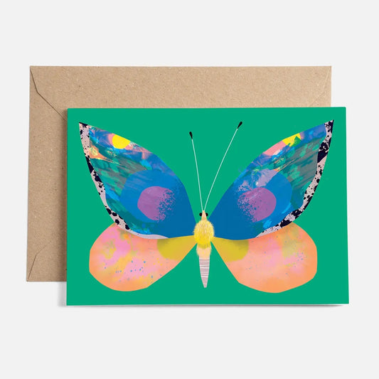 A colourful artistic representation of a butterfly on a green background printed on a card with a brown envelope.