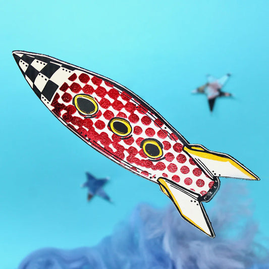 A yellow and red shiny space rocket shaped bookmark made form leather