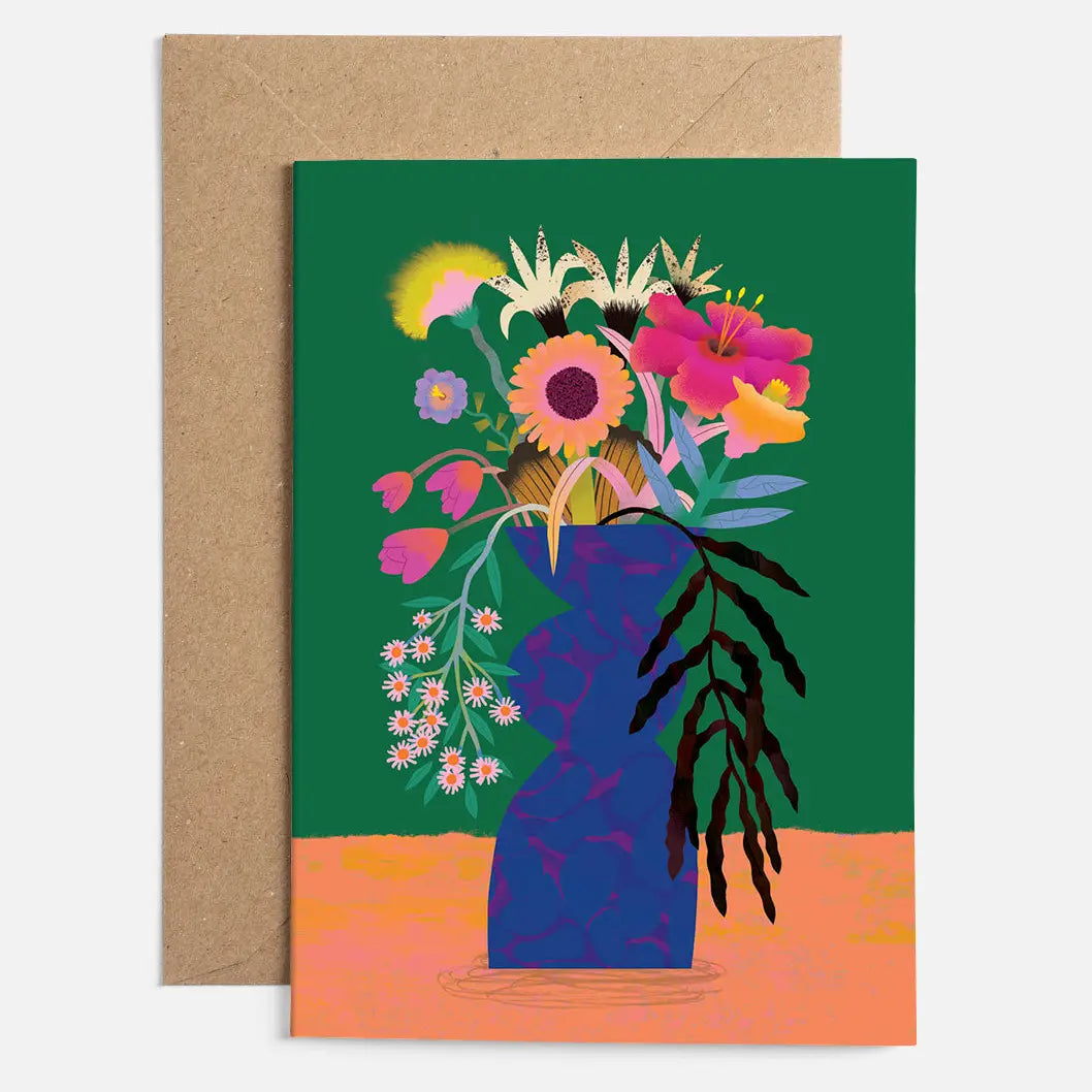 A luxury greeting card featuring a colourful hand-drawn flower bunch design with a bold paper-cut style on a green background.