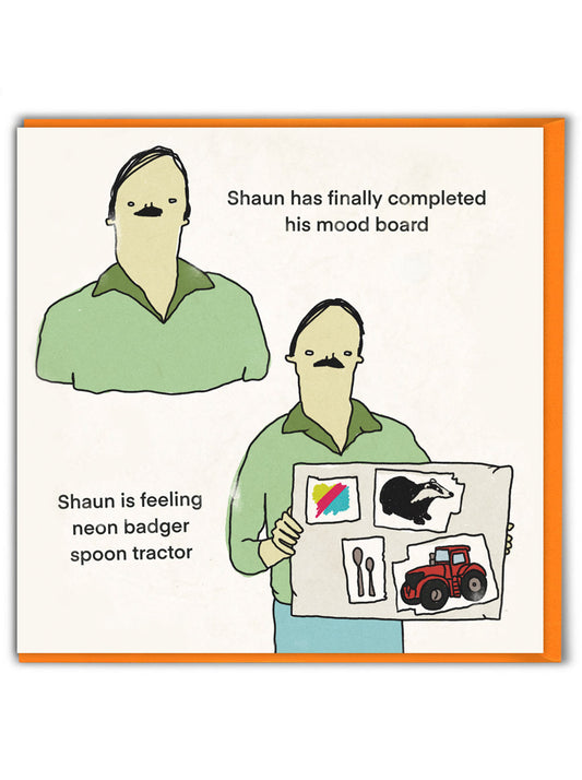 A white card with a cartoon drawing of a man holding up a mood board that he has made. The text on the card reads: Shaun had finally completed his mood board - Shaun is feeling neon badger spoon tractor
