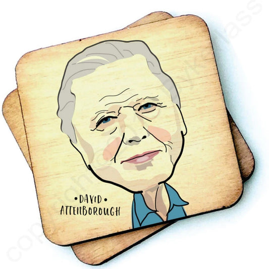 Image shows a wooden drinks coaster with a cartoon graphic of Davis Attenborough on the front