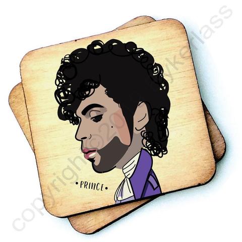 Image shows a wooden drinks coaster with a cartoon graphic of Prince on the front 