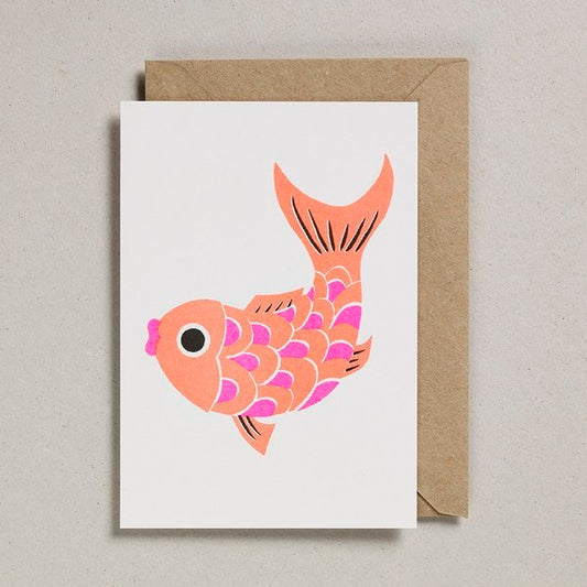 A white card with a print of a orange and pink koi fish on the front. 