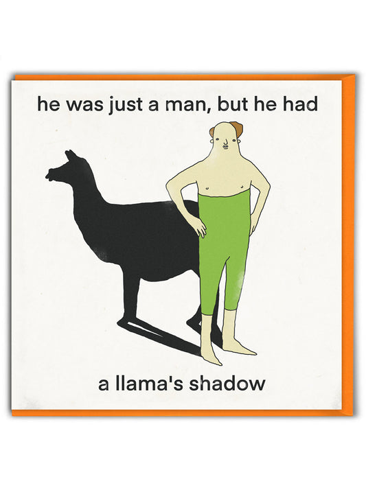 A white card with a cartoon drawing of a man with a llama's shadow. The text on the card reads: 'He was just a man, but he had a llama's shadow'