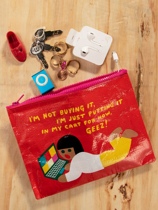 Blue Q zipper pouch with a girl on a laptop. The text reads: Im not buying it Im just putting it in my cart for now GEEZ