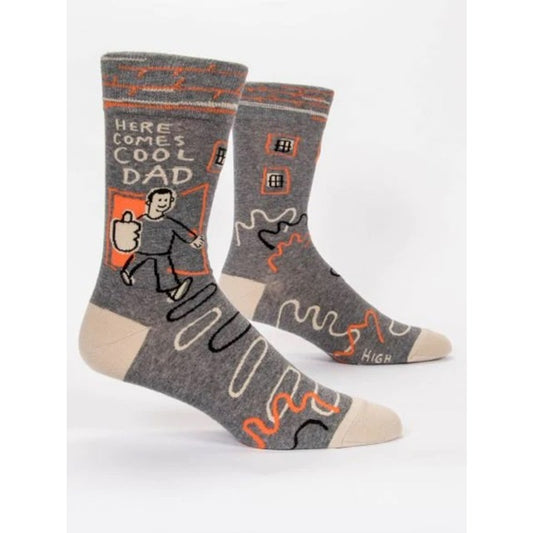 Grey Blue Q socks featuring a man with his thumb up with Grey and orange squiggles. The text reads 'Here comes cool dad'