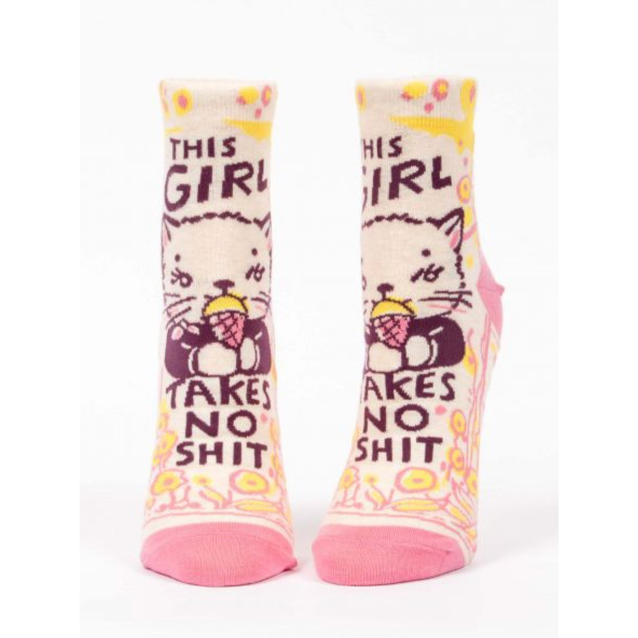 Pink and yellow Blue Q socks with a picture of a cat eating ice cream. The text reads ‘this girl takes no shit’