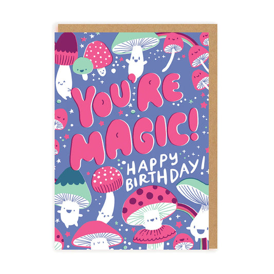 A blue card with pink and green cartoon mushrooms with smiles. The text on the card reads:  You're Magic! Happy Birthday!
