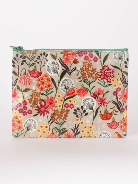 A beige Blue Q Zipper pouch with pink, red, orange and green flowers all over and white daffodils.