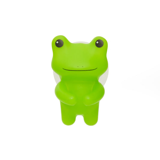 A bright green frog with his arms closed together so it can hold your toothbrush. 