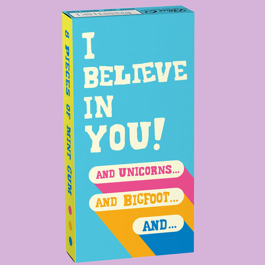 A blue box of Blue Q gum that reads: I believe in you! and unicorns... and bigfoot... and...