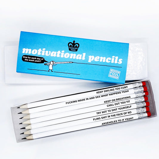 A white box with a blue cardboard slip around that reads: Motivational pencils one for each day one the week yeah? Infront is an open box of pencils that read: Keep smiling you cunt, Try not to shit yourself, Keep on breathing, Fling shit in the face of no, Arseholes to it yeah?, Chill out you tit and Fucking wade in it and see what happens yeah.