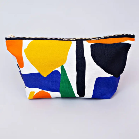 A cosmetic bag with Yellow, green, blue and orange abstract shapes on a white background.