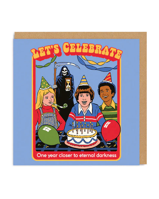 A blue card with 3 children sat round a birthday cake with party hats on. In the background is the Grim reaper waiting with a sand timer. The text on the car reads: Let's celebrate - One year closer to eternal darkness