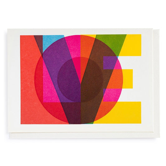 A white card with the word Love spelt out on the front. Each letter is a different colour and its all overlapped to make a lovely colourful print on the front. 