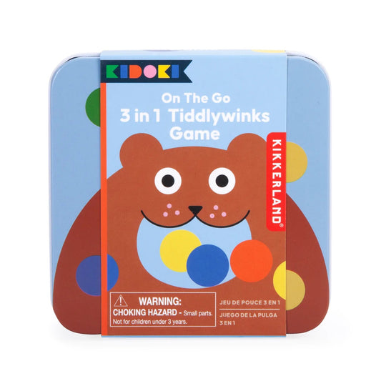 A blue tin with a cartoon bear on the front with yellow red green and blue circles around him. There is a cardboard strip around the tin that reads: On the go 3 in 1 Tiddlywinks game 