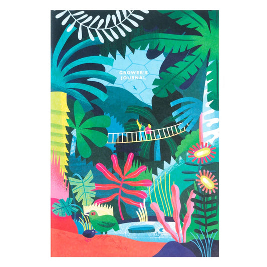 A pink, green, blue and red notebook with tropical plants and flowers all over. The text on the notebook reads: Growers journal
