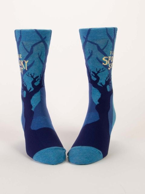 Blue Q socks that are blue with darker blue mysterious trees silhouettes all over.