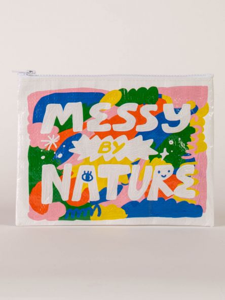 A white zipper pouch with green, blue, pink, red and yellow paint splats on the front. The text reads: Messy by nature