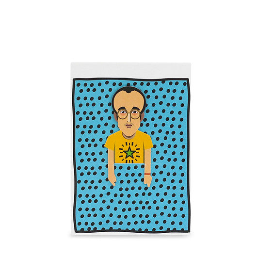 Image shows paper sketch pad with graphic of artist Keith Haring and removable paper bookmark tucked into a slit on the front cover