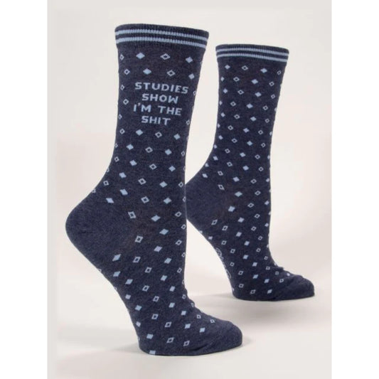 Blue Q socks that are dark blue with a little diamonds print. The text on them reads 'studies show I'm the shit'