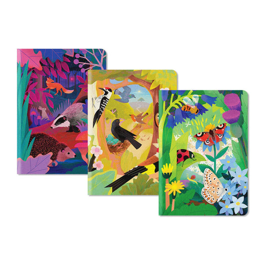 Three colourful Natasha Durley notebooks with animal and nature illustrations on a white background