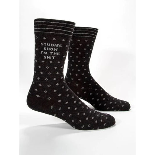 Blue Q socks that are black with a little diamond print. The text on them reads 'studies show I'm the shit'