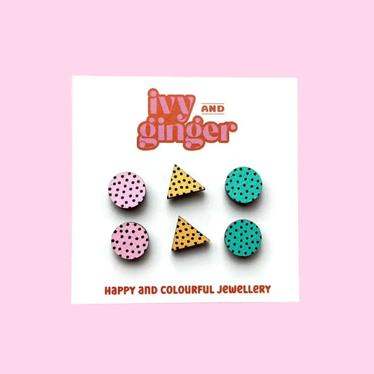 A set of colourful hand-painted wooden earrings by Ivy and Ginger, displayed on a white backing card.