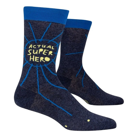A pair of Blue Q socks with blue band round the top. The text in the middle of the socks that reads ‘Actual super hero’
