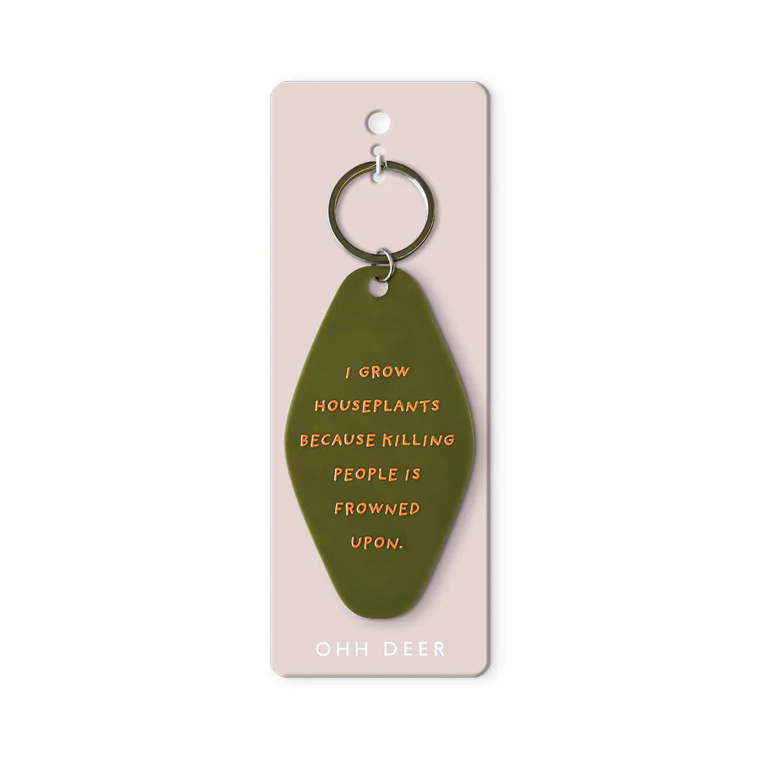 Green keychain with humorous text on a pink card, brand 'Ooh Deer' visible