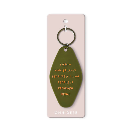 Green keychain with humorous text on a pink card, brand 'Ooh Deer' visible