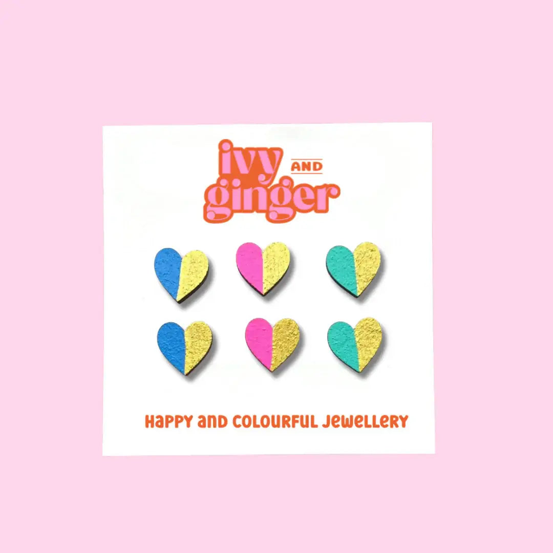 A set of colourful heart-shaped earrings by Ivy and Ginger, displayed on a card with the brand name Ivy and Ginger.