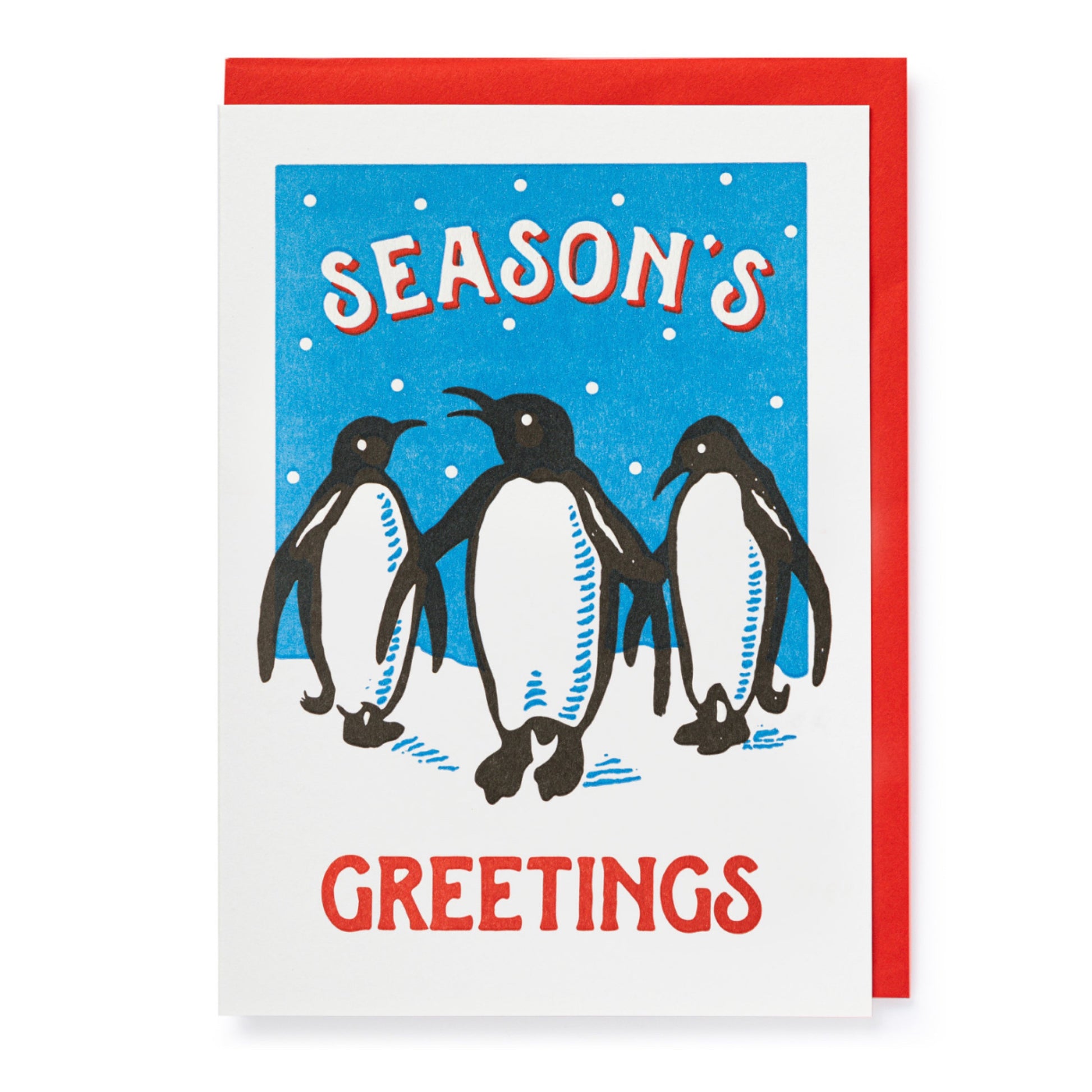 An archivist letterpress card with 3 penguins on the front. The text on the card reads: Seasons greetings.