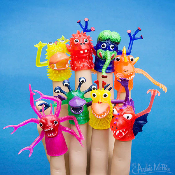 Eight different finger monster puppets on someone's hand. The monsters are all different colours and styles.