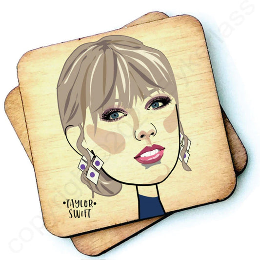 Image shows a wooden drinks coaster with a cartoon graphic of Taylor Swift on the front