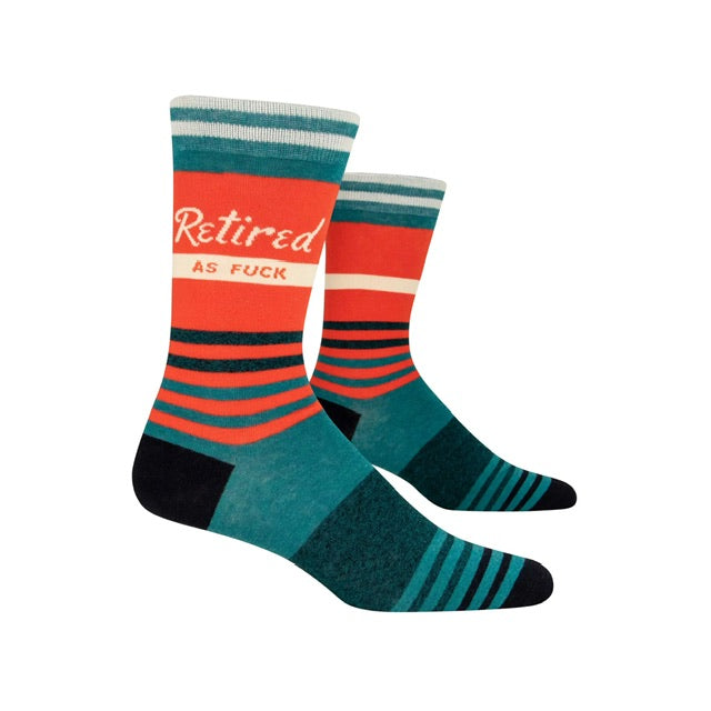 Blue q  'Retired as F***' socks text on the side in white lettering, set against a striped background.