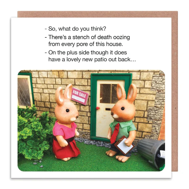 Card with rabbit figures and humorous text about a house for sale.