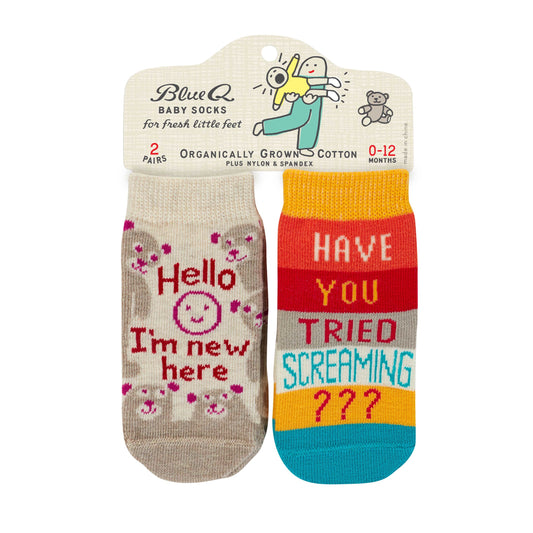 2 pairs of baby socks with text on that reads: 'Hello I'm new here' and 'Have to tried screaming?'