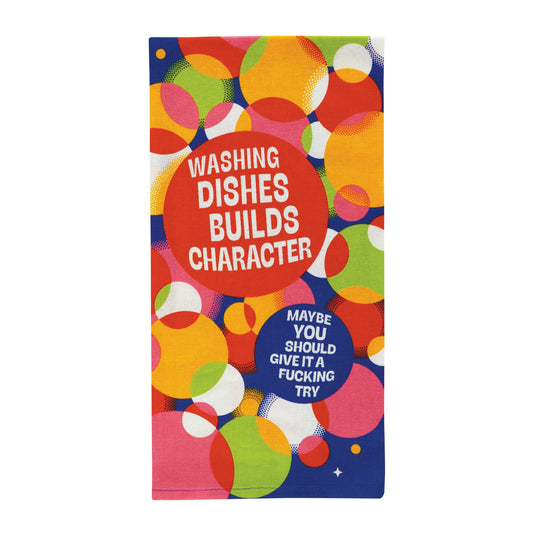 Colourful dish towel with circles. Text reads “WASHING DISHES BUILDS CHARACTER,” “MAYBE YOU SHOULD GIVE IT A F***ING TRY.”  