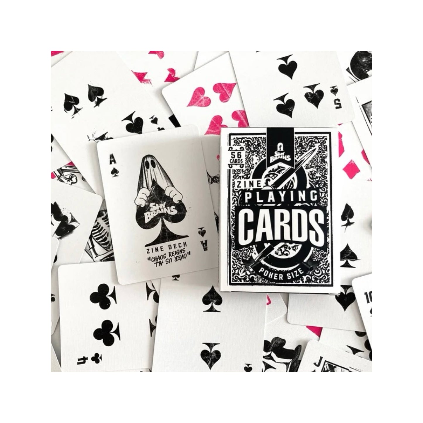 A pack of Zine playing cards with funky designs and the ace with 'Shy brains' written in the middle being held by a ghost 