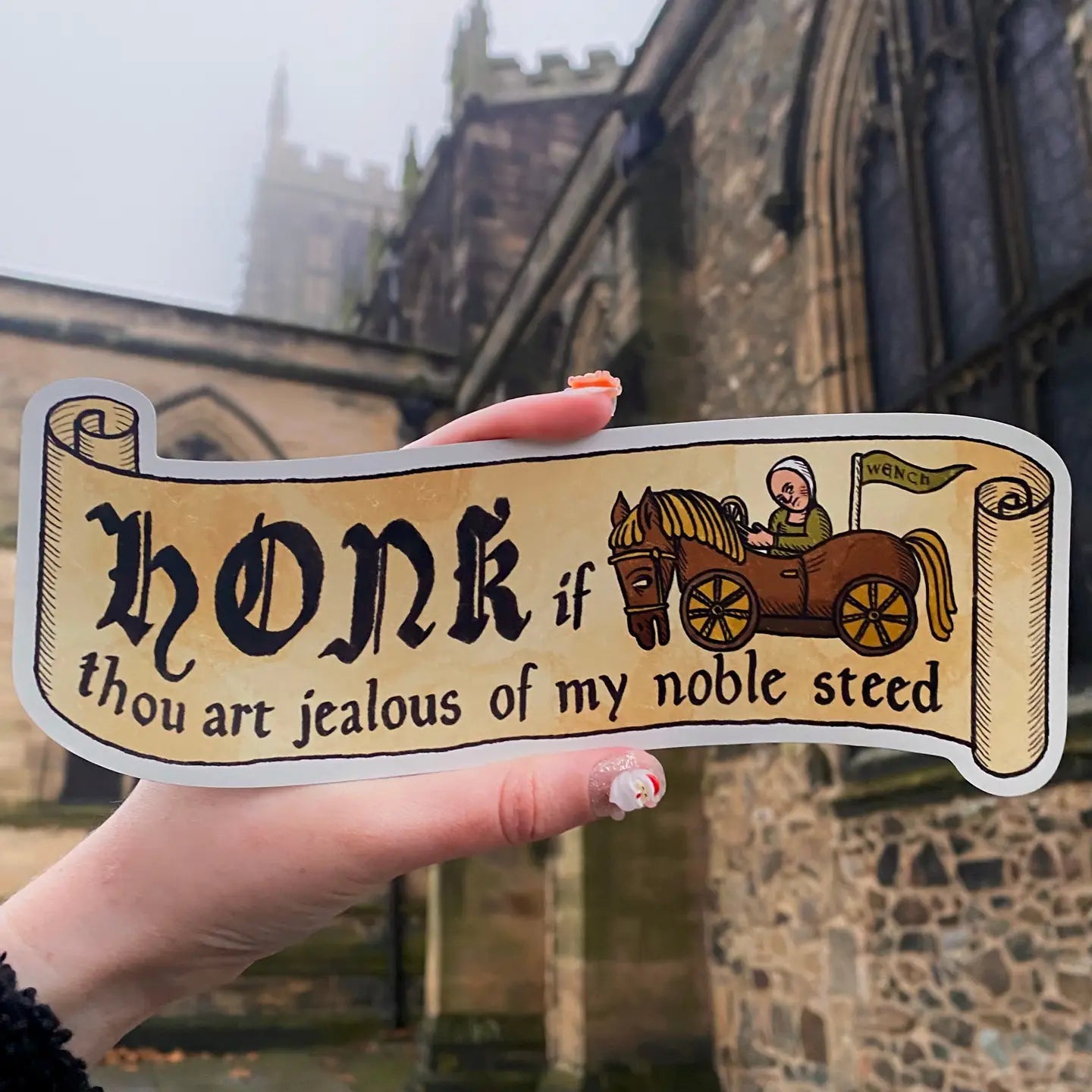 A magnetic bumper sticker with text on that reads 'Honk if thou art jealous of my noble steed'