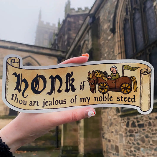 A magnetic bumper sticker with text on that reads 'Honk if thou art jealous of my noble steed'